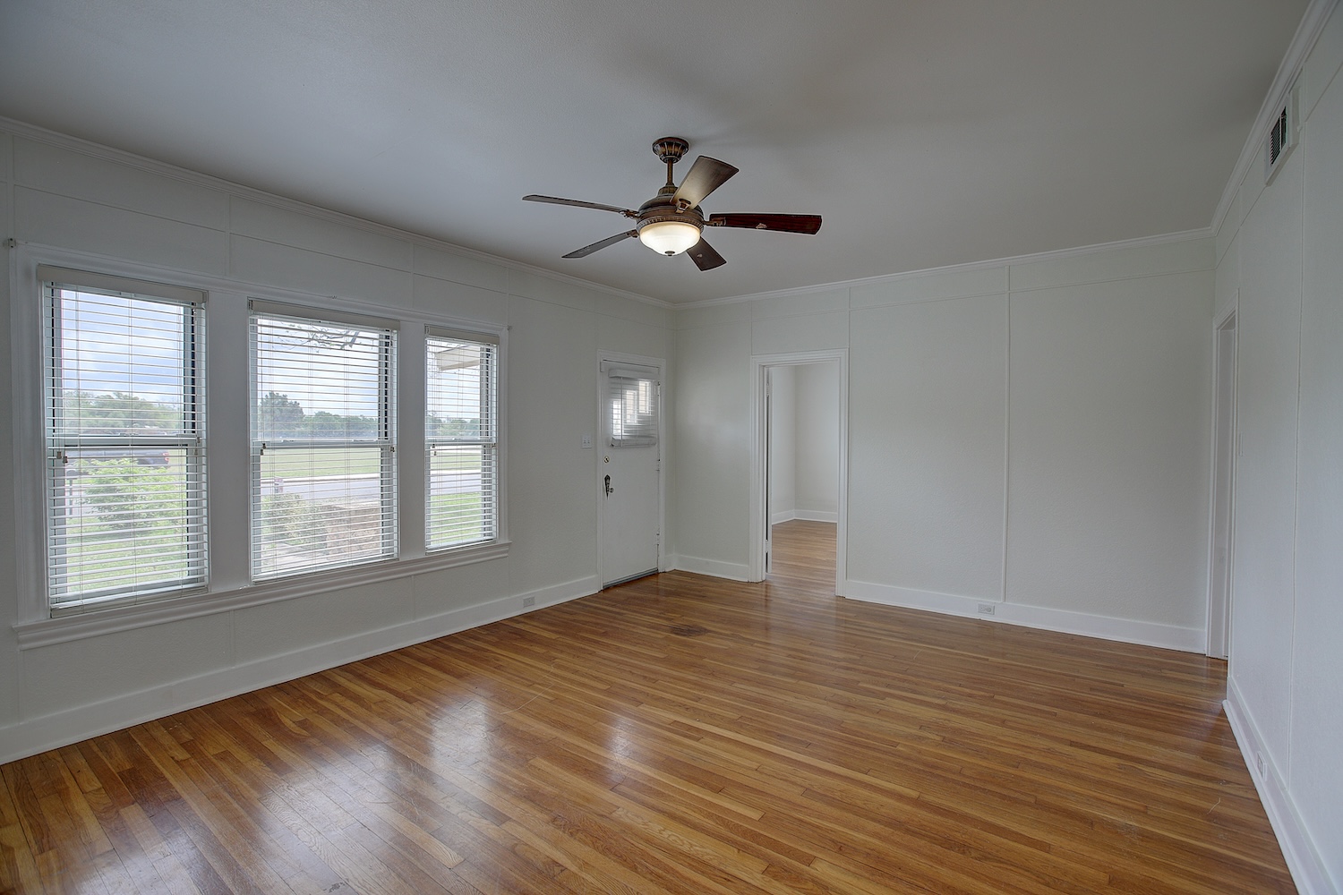 1708 Olive Street Georgetown, TX 78626 - Photo 5 of 40 a view of empty room with wooden floor and fan
