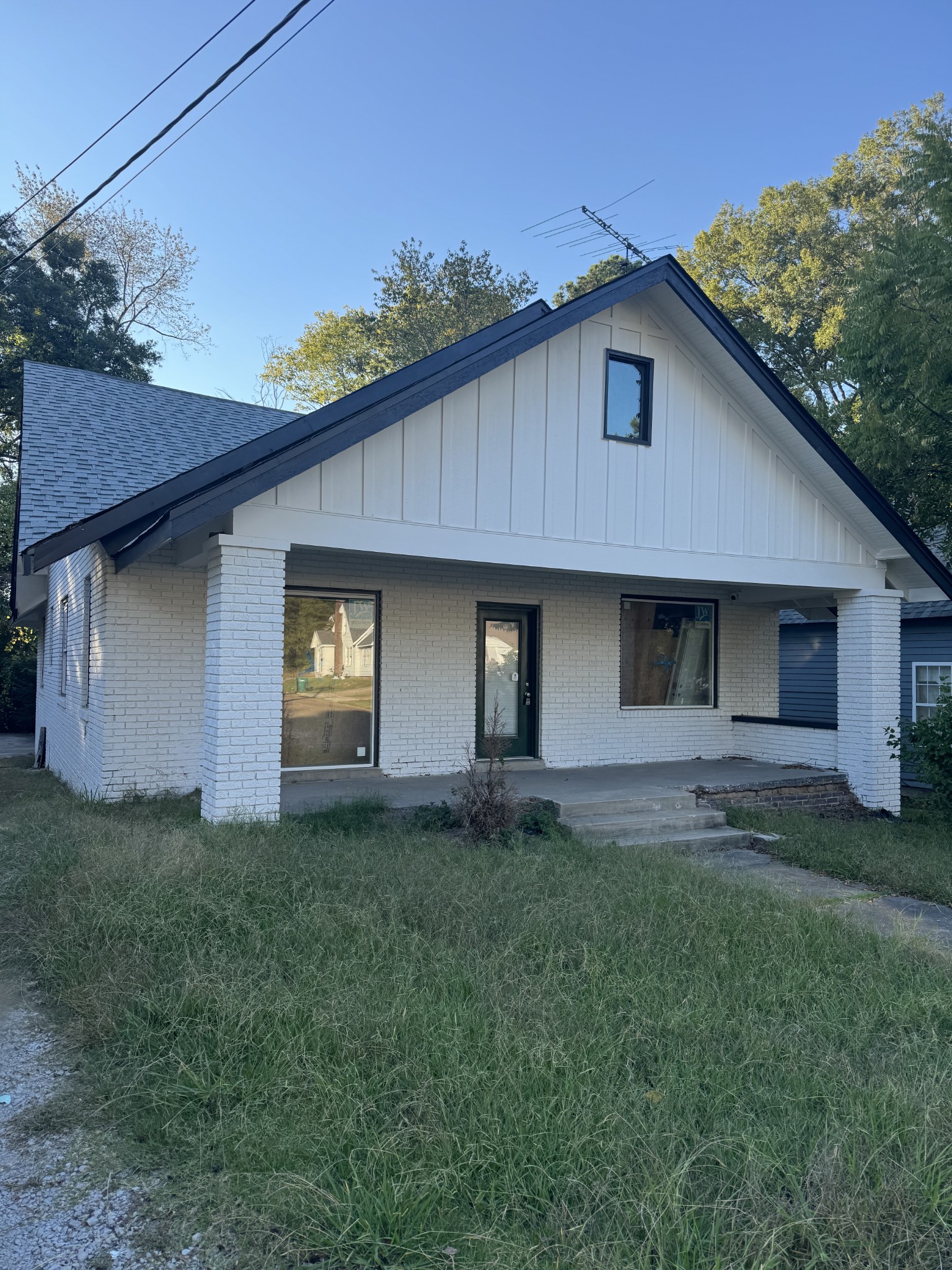 a house with lots of trees in the background