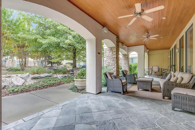 a lobby with furniture and garden view