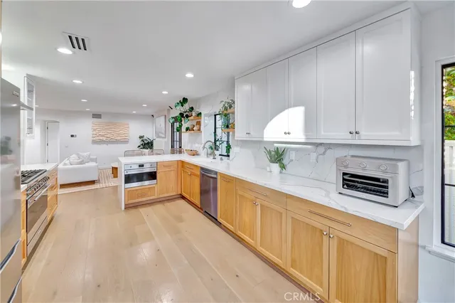 a dining room with furniture a rug and a large window