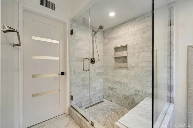 a bathroom with a granite countertop sink mirror and double