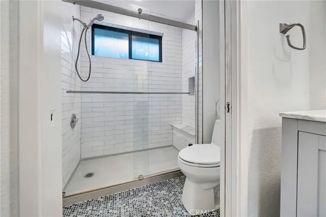 a bedroom with bed and a window