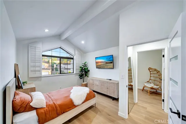 a en suite bathroom with a granite countertop sink and a mirror
