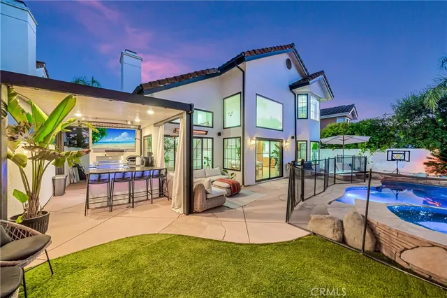 a bedroom with furniture and a large window