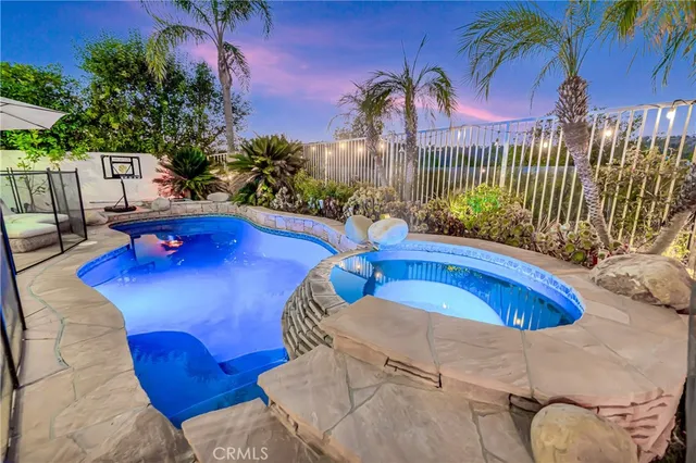 a view of a swimming pool with lounge chair