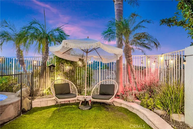 a dining room with furniture and a floor to ceiling window