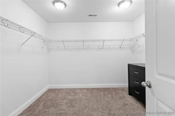 a view of an empty walk in closet