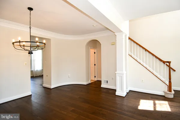 a view of an entryway with wooden floor