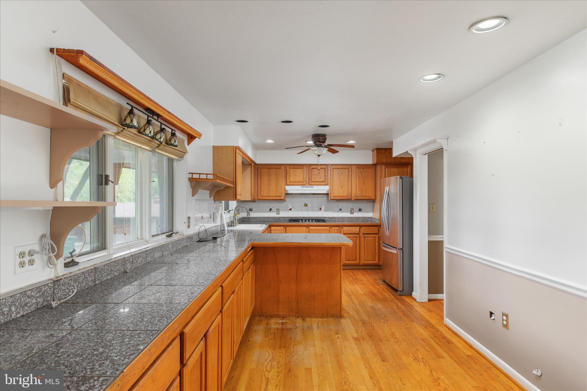 263 Bowling Green Road Front Royal, VA 22630 - Photo 21 of 75 a view of a kitchen with kitchen island a counter top space a sink and stainless steel appliances