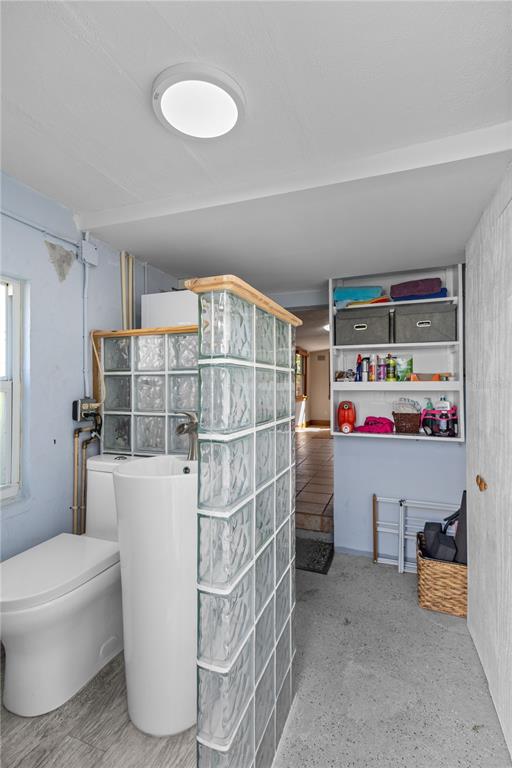 109 Burney Road Osprey, FL 34229 - Photo 28 of 56 Half bath with pedestal sink in utility/laundry room and accessible from back yard.