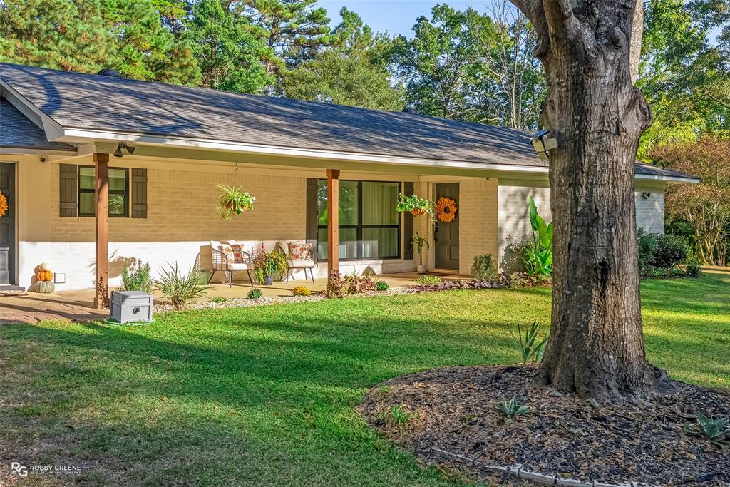 146 Bolinger Hill Road Plain Dealing, LA 71064 - Photo 2 of 32 a view of a house with backyard