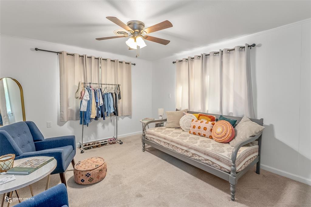 146 Bolinger Hill Road Plain Dealing, LA 71064 - Photo 22 of 32 a living room with furniture and a large window