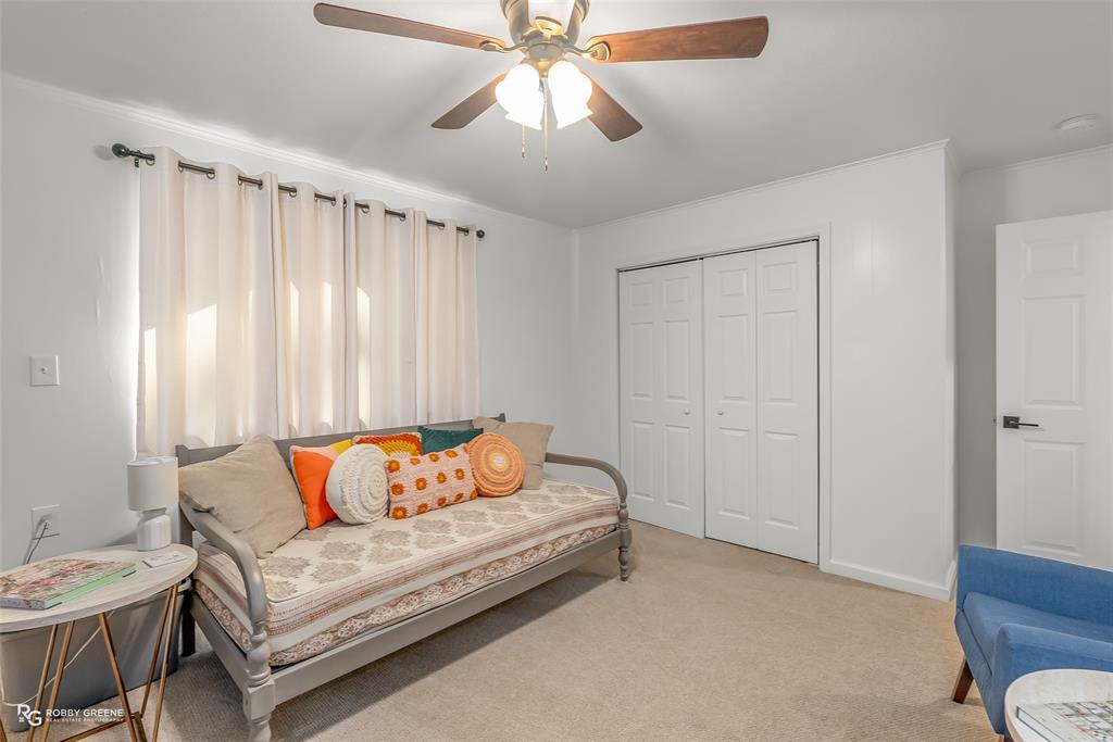 146 Bolinger Hill Road Plain Dealing, LA 71064 - Photo 23 of 32 a living room with furniture and a chandelier