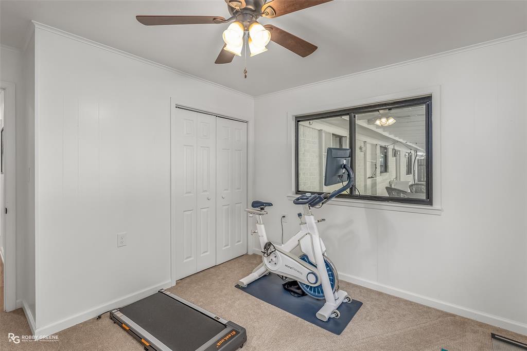 146 Bolinger Hill Road Plain Dealing, LA 71064 - Photo 25 of 32 a room with gym equipment