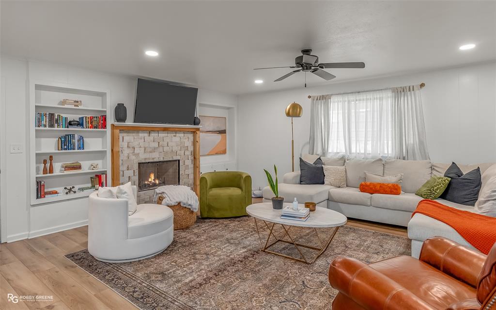 146 Bolinger Hill Road Plain Dealing, LA 71064 - Photo 3 of 32 a living room with furniture and a fireplace