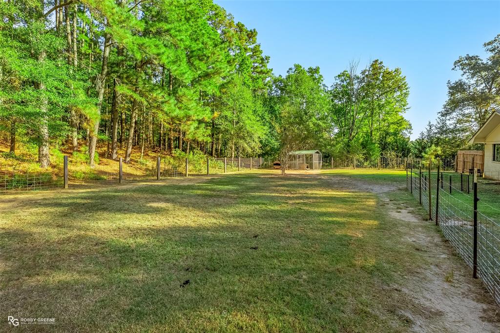146 Bolinger Hill Road Plain Dealing, LA 71064 - Photo 31 of 32 a view of a house with a big yard