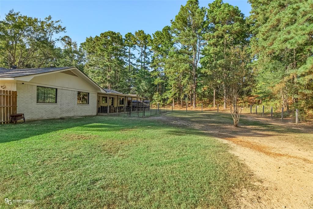 146 Bolinger Hill Road Plain Dealing, LA 71064 - Photo 32 of 32 a view of a house with a yard