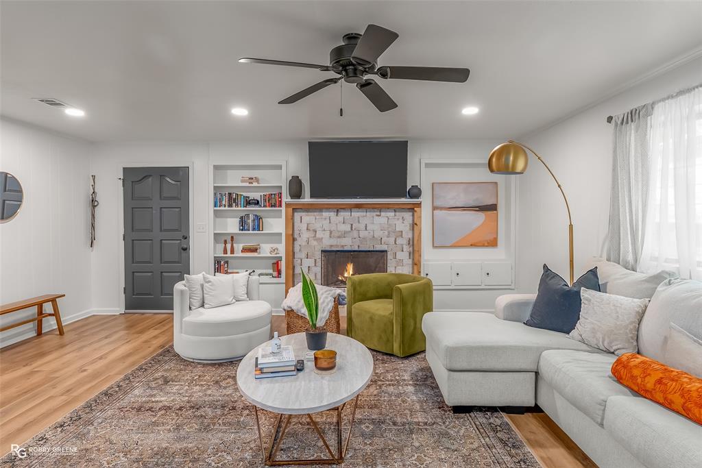 146 Bolinger Hill Road Plain Dealing, LA 71064 - Photo 4 of 32 a living room with furniture and a fireplace