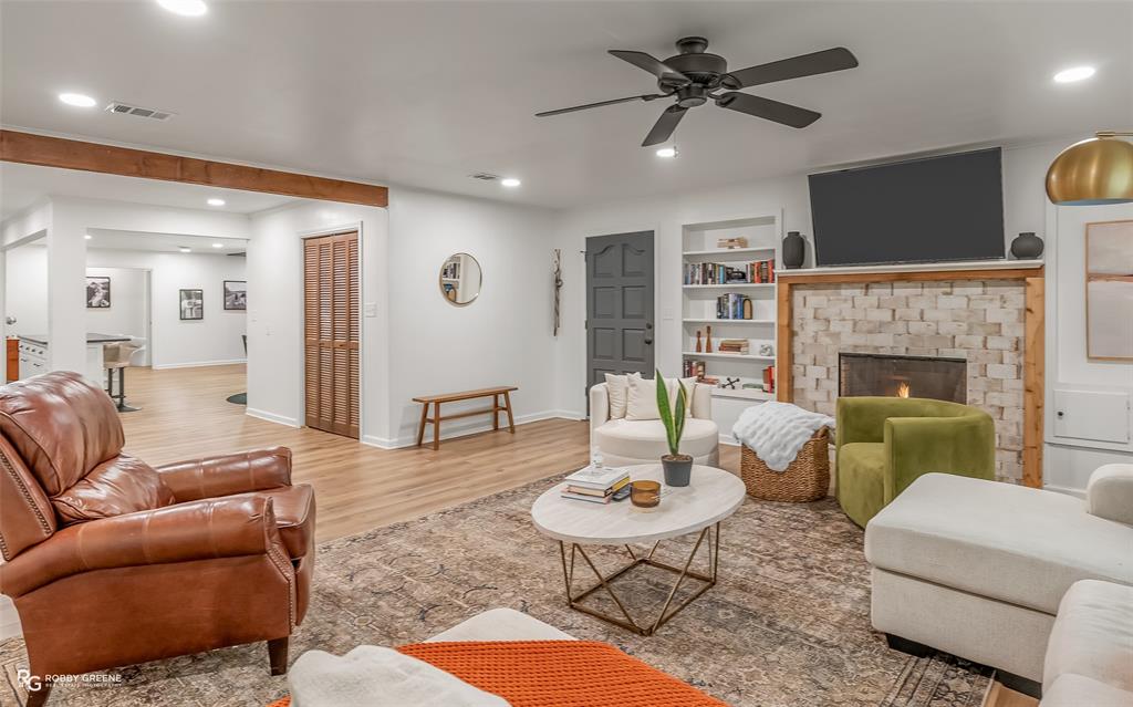 146 Bolinger Hill Road Plain Dealing, LA 71064 - Photo 6 of 32 a living room with furniture and a fireplace