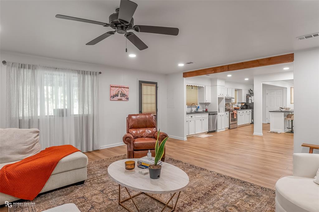 146 Bolinger Hill Road Plain Dealing, LA 71064 - Photo 7 of 32 a living room with furniture kitchen view and a chandelier