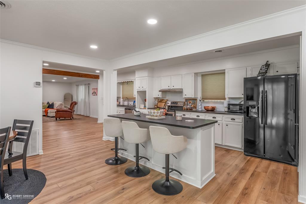 146 Bolinger Hill Road Plain Dealing, LA 71064 - Photo 8 of 32 a kitchen with a sink appliances and cabinets