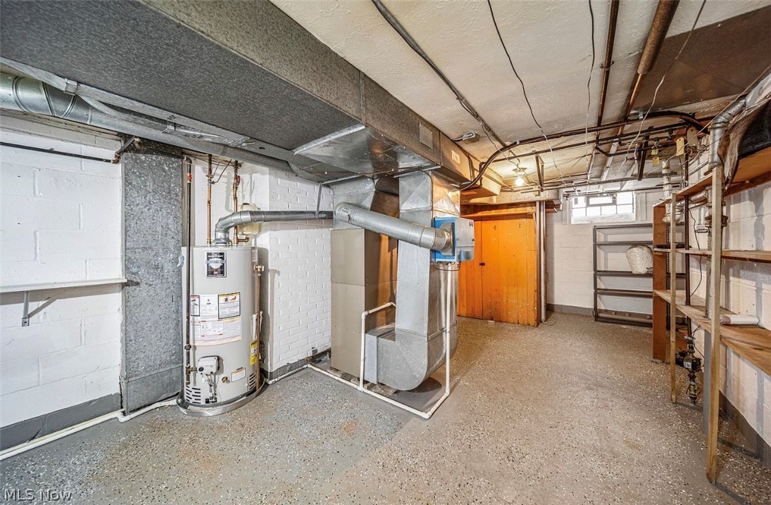4069 Bushnell Road Cleveland, OH 44121 - Photo 29 of 39 Basement with water heater and heating unit