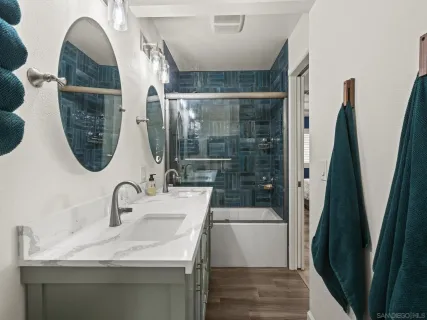 a bathroom with a sink and mirror