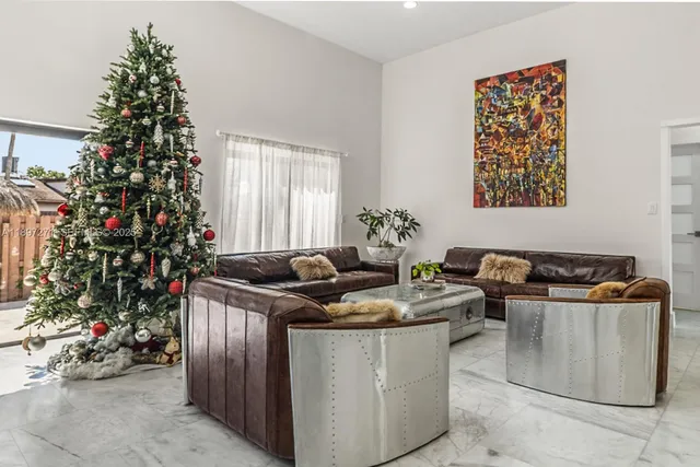 a table with a potted plant sitting next to a window