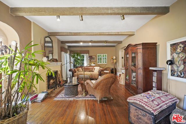a bathroom with a sink a toilet and shower curtain