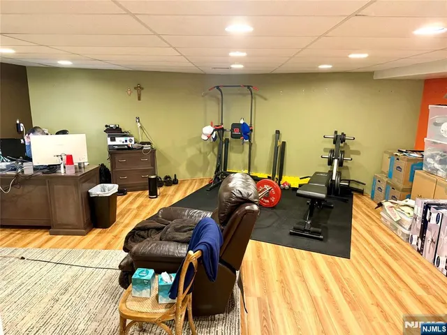 a view of a living room with furniture and a floor to ceiling window