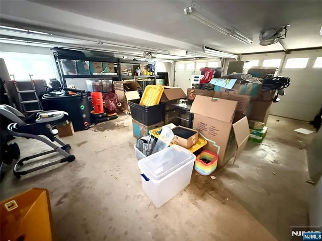 a dining room with furniture a rug and wooden floor