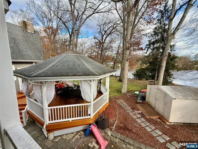 a view of a swimming pool with lounge chairs