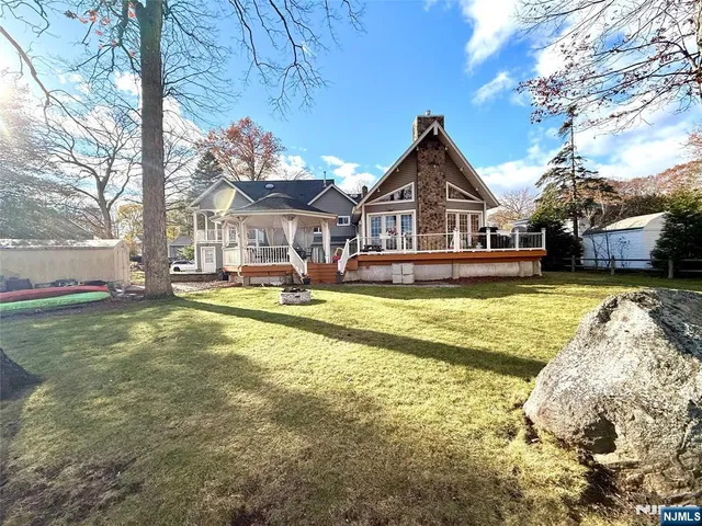 a view of a lake with wooden deck