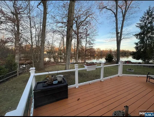 a bathroom with a sink double vanity mirror toilet and bathtub