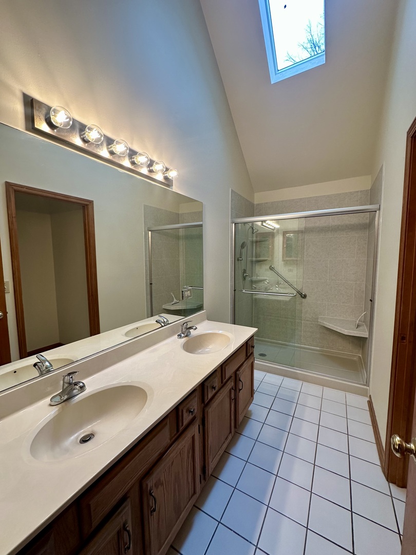 4216 White Ash Road Crystal Lake, IL 60014 - Photo 18 of 34 a bathroom with a sink a double vanity and a mirror