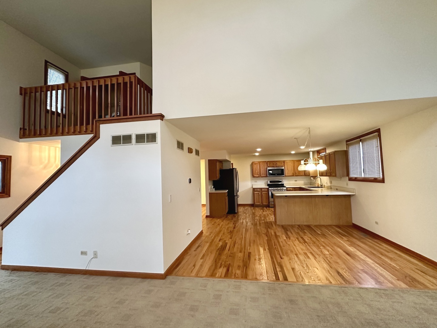 4216 White Ash Road Crystal Lake, IL 60014 - Photo 5 of 34 a view of kitchen with furniture and wooden floor