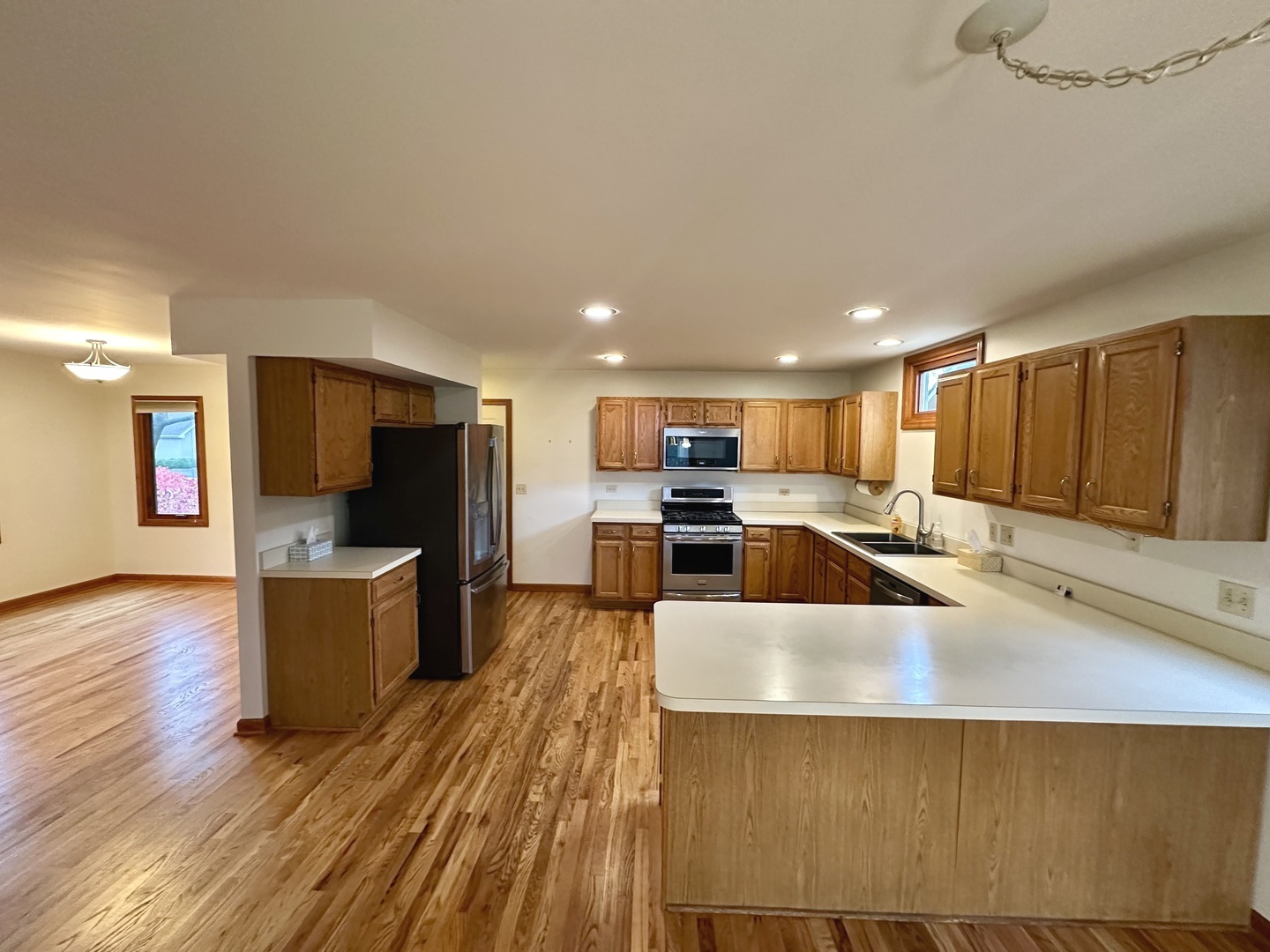 4216 White Ash Road Crystal Lake, IL 60014 - Photo 7 of 34 a large kitchen with a table and chairs