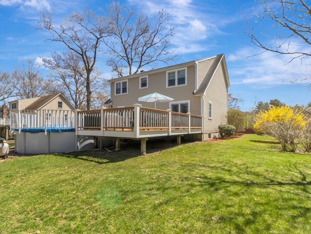 15 Riverside Drive Mansfield, MA 02048 - Photo 33 of 42 a house that has a big yard with wooden fence