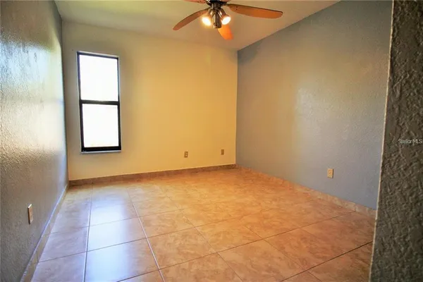 an empty room with a bathroom
