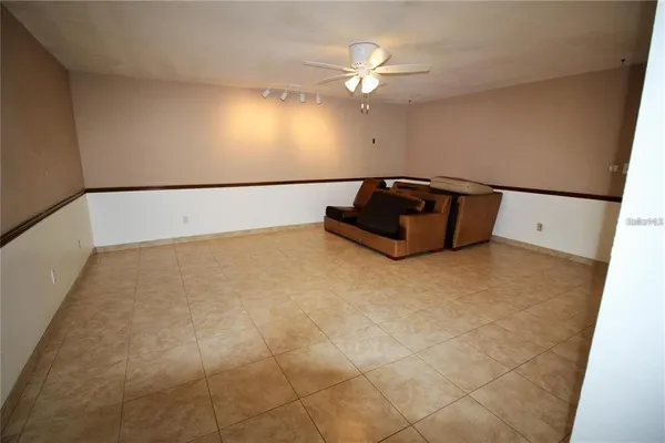a bathroom with a bathtub and a chandelier