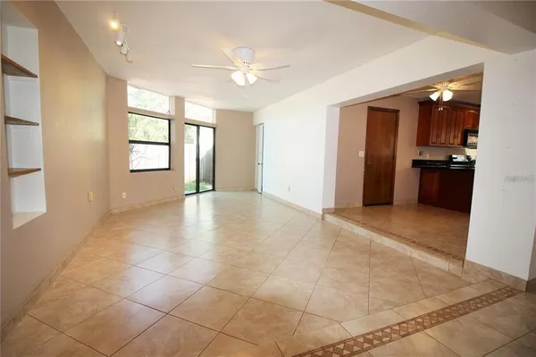 a view of a kitchen with furniture and a window