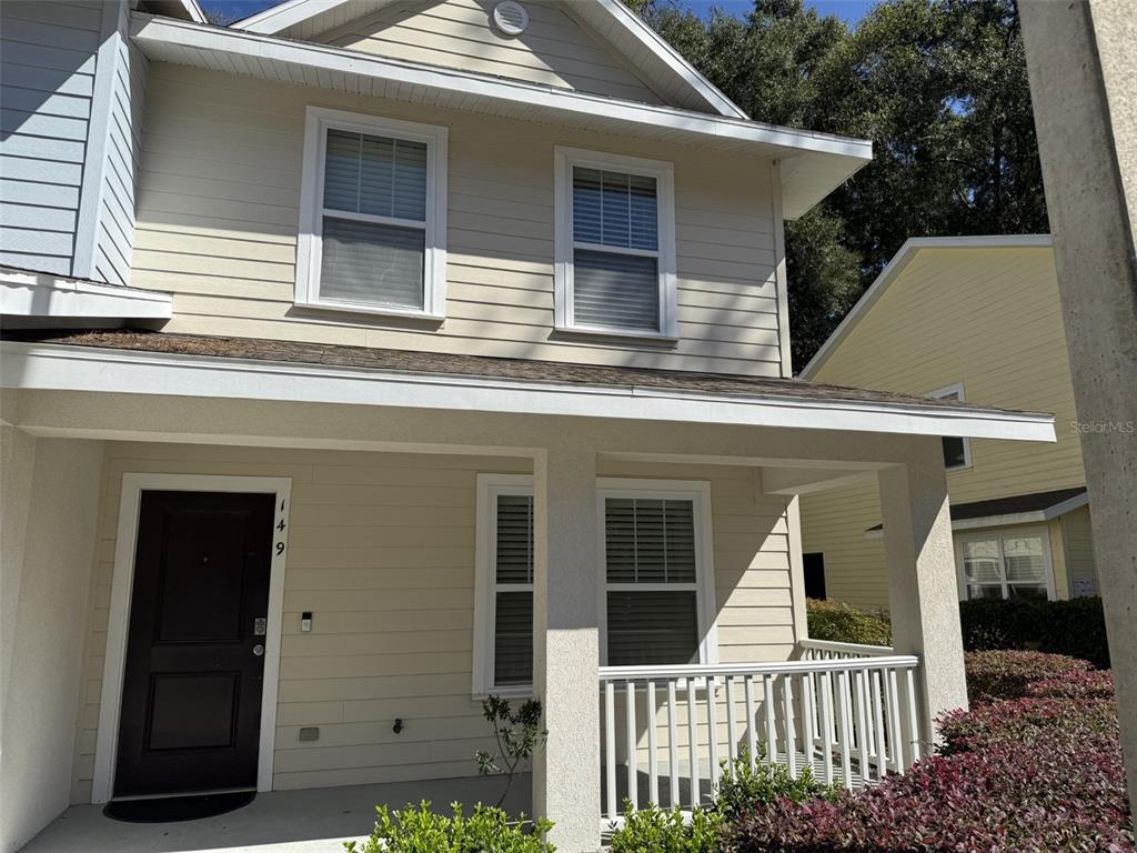 4639 Southwest 48th Drive, Unit 149 Gainesville, FL 32608 - Photo 2 of 13 a view of a house with a small porch