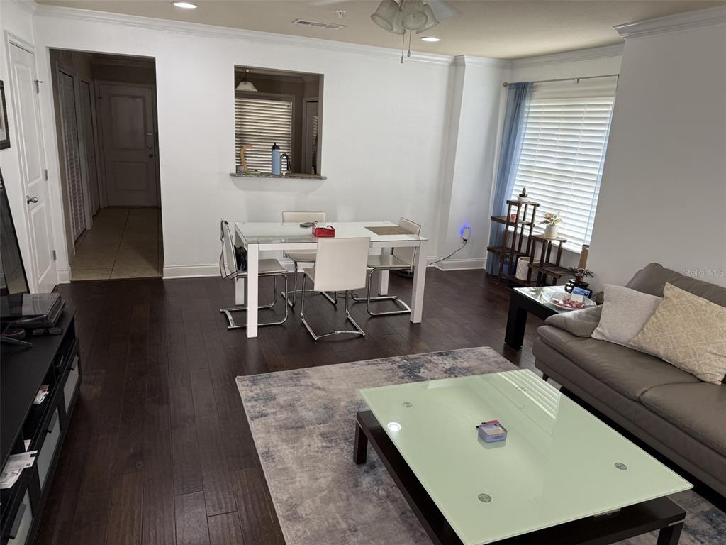 4639 Southwest 48th Drive, Unit 149 Gainesville, FL 32608 - Photo 4 of 13 a living room with furniture and a flat screen tv