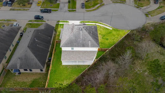 a bird view of a house with a yard