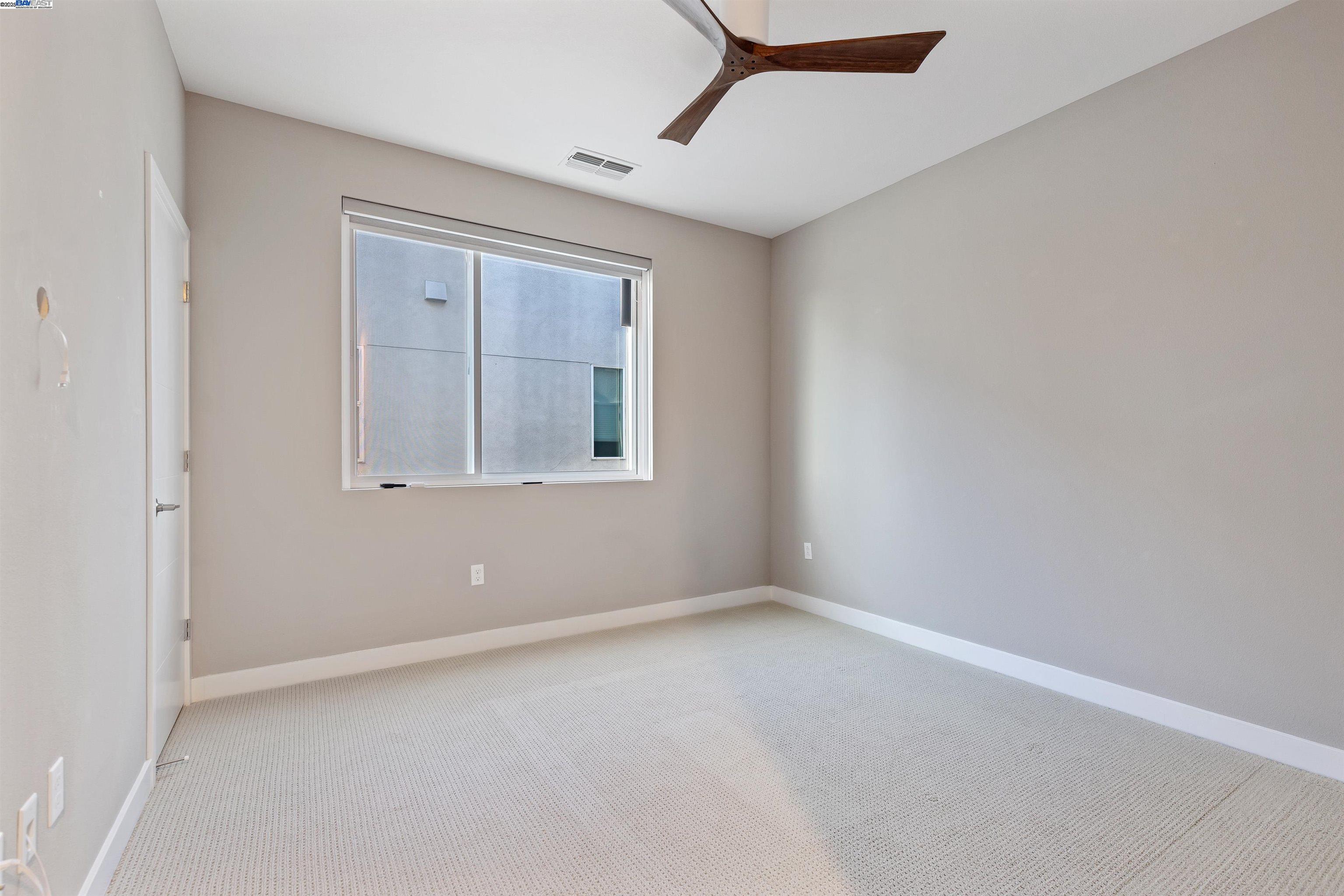 3957 Wattling Street Oakland, CA 94601 - Photo 13 of 23 a view of an empty room with a window