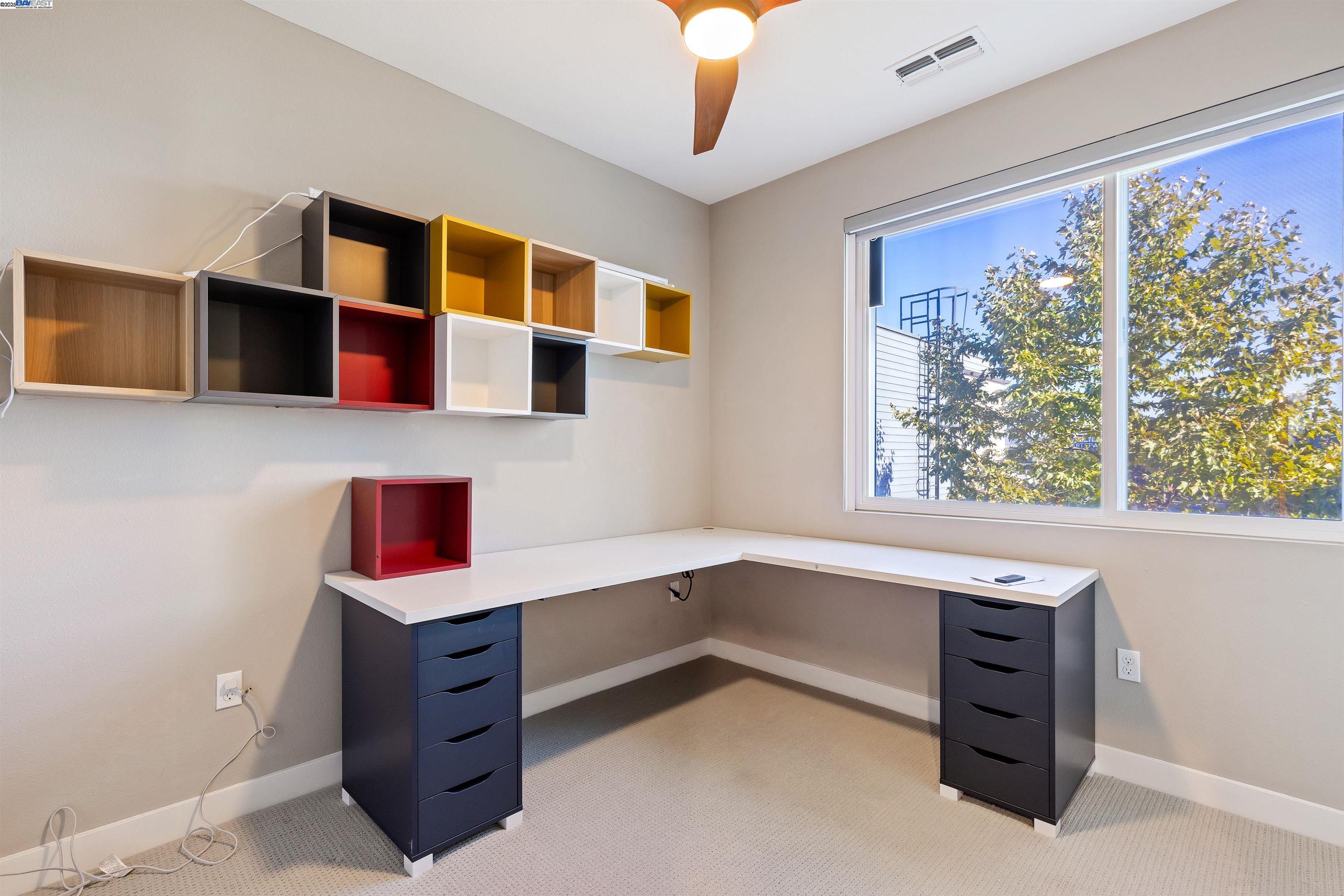 3957 Wattling Street Oakland, CA 94601 - Photo 20 of 23 a workspace with furniture and window