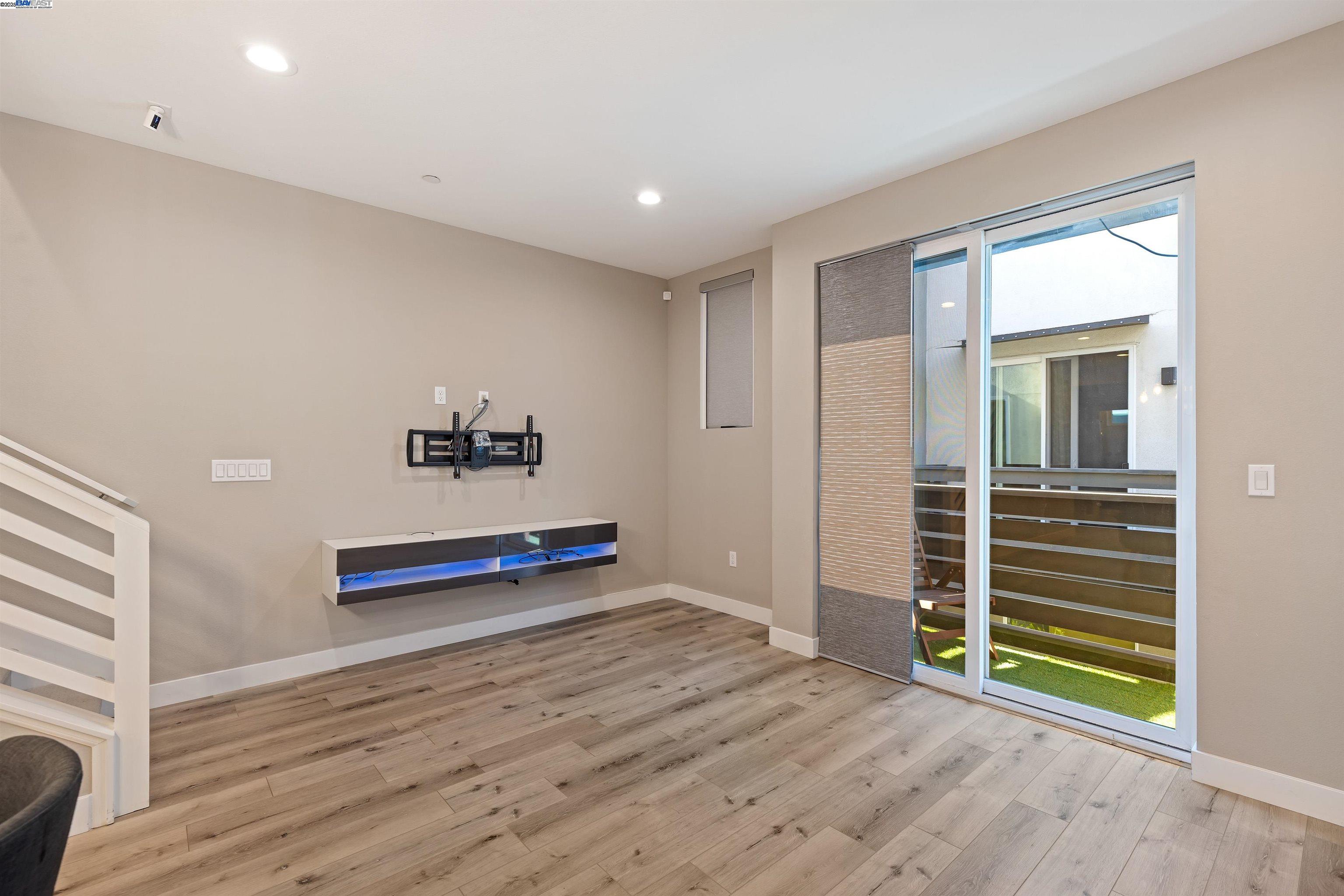 3957 Wattling Street Oakland, CA 94601 - Photo 8 of 23 a view of a room with wooden floor and window