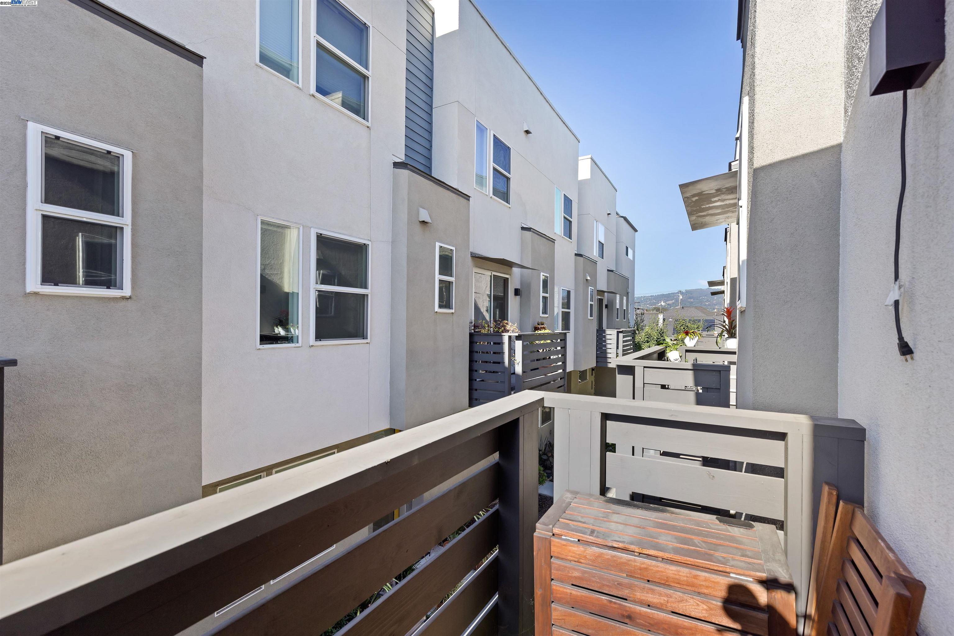 3957 Wattling Street Oakland, CA 94601 - Photo 9 of 23 a room with lot of cabinets and bed