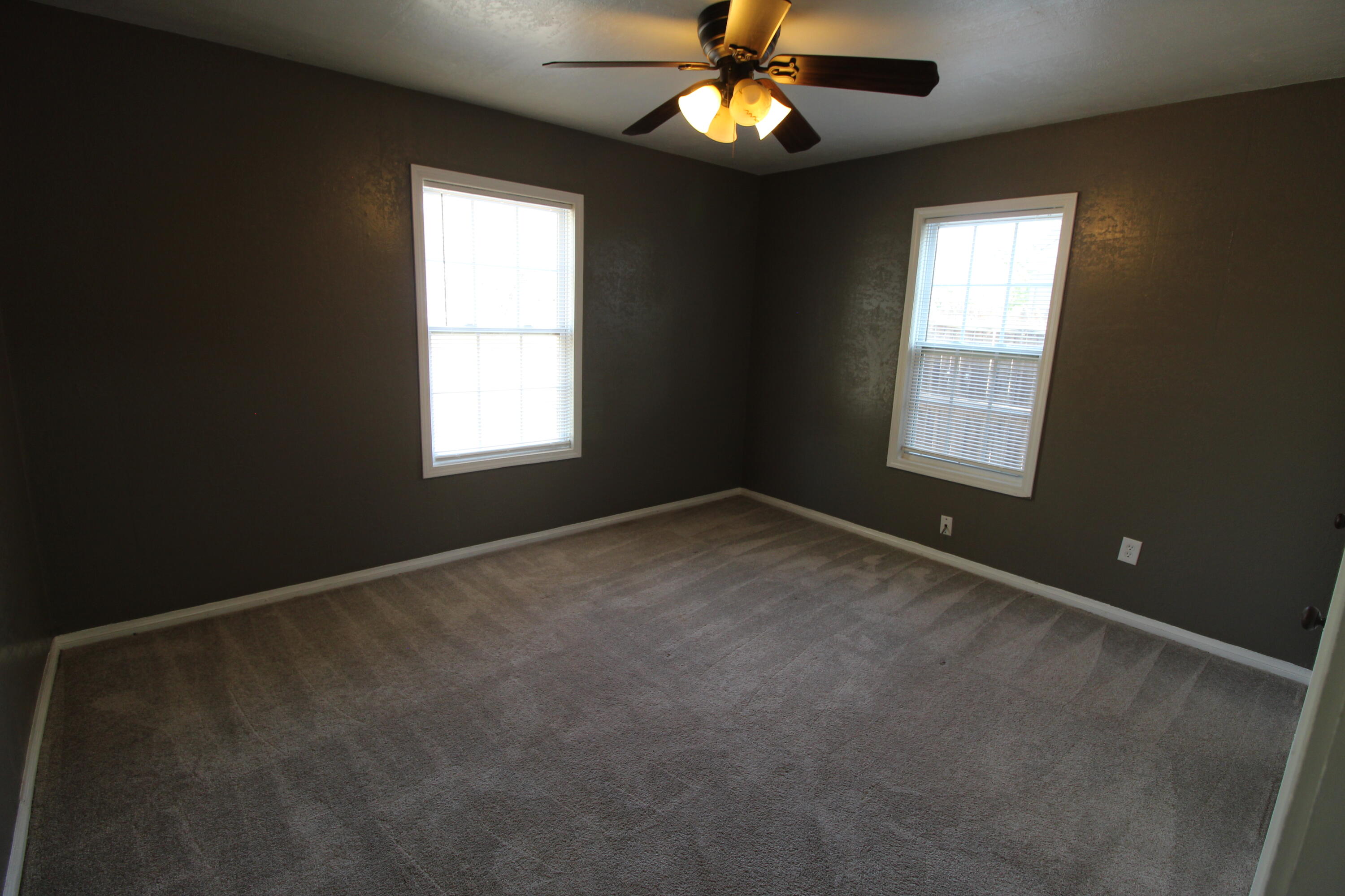 2209 25th Street Lubbock, TX 79411 - Photo 14 of 22 an empty room with a window and a fan