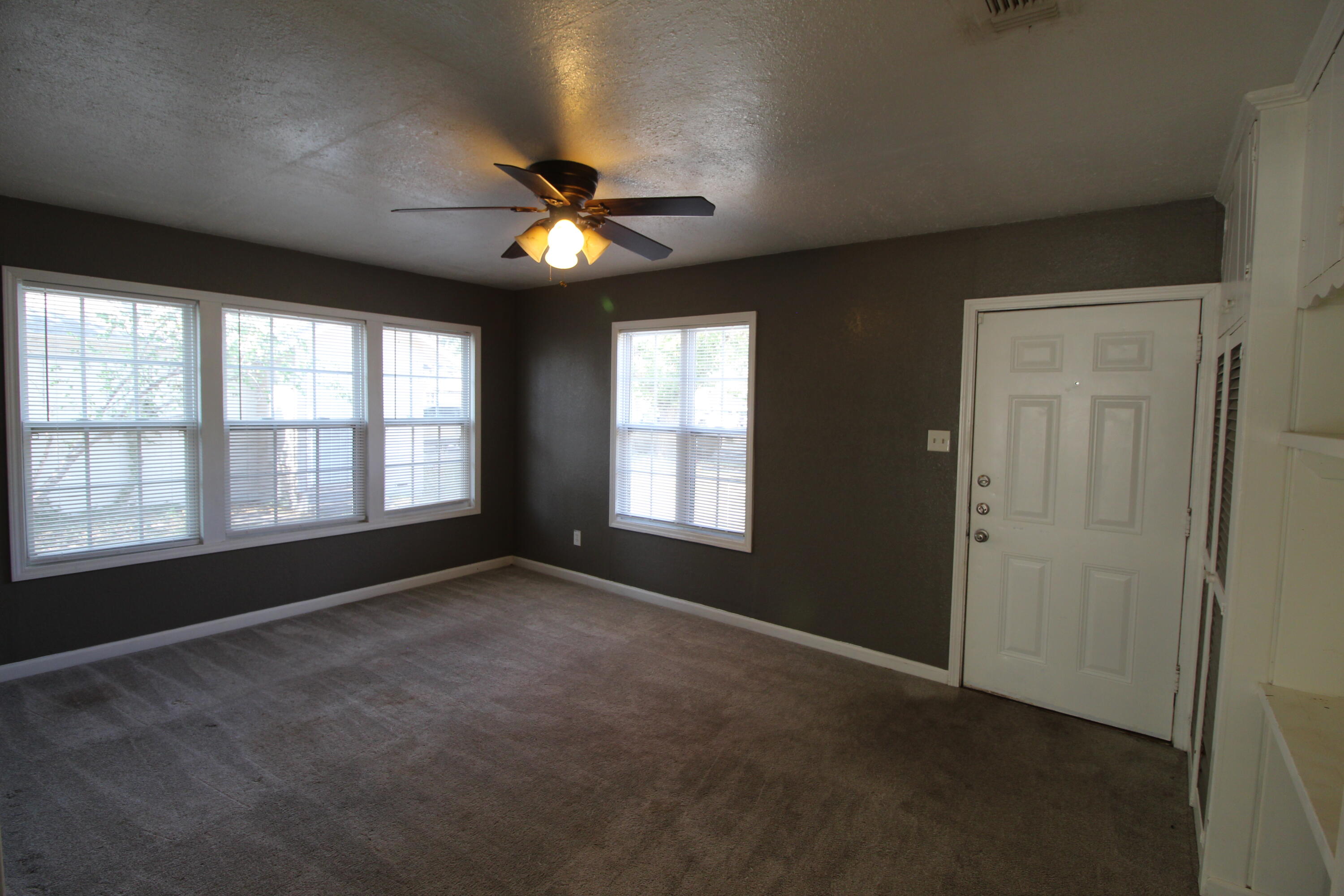 2209 25th Street Lubbock, TX 79411 - Photo 6 of 22 a view of an empty room with a window